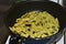 Frying French Fries in sunflower oil in a frying pan