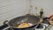 Frying fresh vegetables in a wok. Cooking Asian food. Cooking Mediterranean