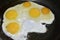 Frying fried eggs in a frying pan