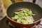 Frying garlic green in a non stick pan