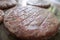 Frying hamburger meat on a large griddle pan