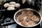 Frying meatballs on the stove in a frying pan