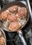 Frying meatballs on the stove in a frying pan