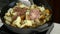 Frying mushrooms with ingredients.