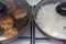 A frying pan with meatballs and a frying pan with rice stand side by side. close-up. food idea and home cooking