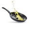 Frying pan and splashing cooking oil on white background