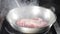 Frying pan with White thick steam in restaurant kitchen. Cooking steak meat. Slow motion. White Water Vapour. Food video