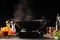 Frying in a pan, wok. Vegetables and meat, on a black background. Culinary banner. Culinary and gastronomy. Recipe book
