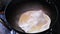 Frying papadam in hot oil.Papadam is a traditional indian snack used as a side dish to main course meal