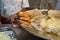 Frying yellow and white potato tikki on hot plate