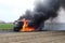 Fuel carrier in flames. Truck burning on the road. Neural network AI generated