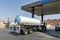 fuel delivery to the gas station. Fuel industry. Tanker gas truck delivering fuel at service station