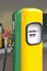Fuel dispenser yellow and green vintage gasoline with red handle