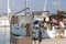 Fuel distributor on the pier of a gas station in the Mediterranean marina against the backdrop of sailing yachts. Refualing boats