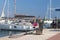 Fuel distributor on the pier of a gas station in the Mediterranean marina against the backdrop of sailing yachts. Refualing boats