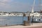 Fuel distributor on the pier of a gas station in the Mediterranean marina against the backdrop of sailing yachts. Refualing boats