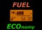 Fuel economy: fuel gauge and odometer showing a minimal fuel consumption. Ecology and economy concept.