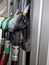 Fuel guns at gas station with petrol and diesel fuel for automobile transport