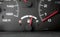 Fuel indicator needle in focus ,dirty dashboard