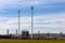 Fuel refinery with chimney and furnace.  Blue sky overhead