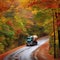 Fuel Tanker Truck on Winding Road through Autumn Forest