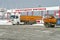 Fuel truck with an orange tank on the outskirts of