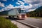 Fuel truck rushes down the highway in the background the Alps. T