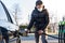 Fueling the car at the time of the epidemic coronavirus with a respirator over his mouth and nose