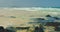 Fuerteventura, Grandes Playas Corralejo. Transparent shallow ocean waves splashing foam. Volcanic beach with white sand
