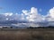 Fuffy clouds open field beautiful  day