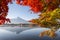 Fuji Mountain Reflection and Red Maple Leaves in Autumn at Kawaguchiko Lake, Japan