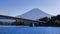 Fuji mountain view from Kawaguchi lake ferry with the bridge, Kawaguchigo, Japan.
