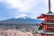 Fujiyoshida landmark of Japan Chureito red Pagoda on Fuji mountain background, clear sky almost in sunset light red Pagoda with pi