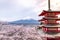 Fujiyoshida landmark of Japan Chureito red Pagoda on Fuji mountain background, clear sky almost in sunset light red Pagoda with pi