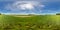 Full 360 degree seamless panorama in equirectangular spherical equidistant projection. Panorama in a field near a road with