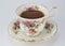 Full antique teacup and saucer with rose and gold decoration iso