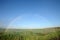 A full arch rainbow showing both ends.