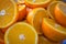 Full Background Frame Of Halves Of Ripe Oranges Lying Randomly On Top Of Each Other