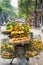 Full basket of orange fruit on vendor bike on Hanoi street, Vietnam