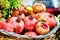 Full basket of pomegranates and fruits