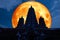 full blood moon back silhouette triple pagoda in night sky