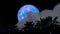 Full blue moon back on night sky and blur cloud moving pass and silhouette ancient trees