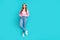 Full body length photo of charming brown wavy hair girl candid posing standing near empty space banner  on blue