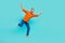 Full body length photo of funky jumping carefree overjoyed businessman positive crazy mood isolated on aquamarine color