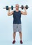 Full body length shot active and sporty senior man lifting dumbbell. Clout