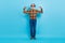 Full body photo of aged man sporty arms muscles healthcare exercise motivation isolated over blue color background
