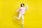 Full body photo of astonished millennial lady dance wear sweater pants isolated on yellow color background