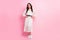 Full body photo of attractive stunning lady hold hands waist wear long dress isolated on pink color background