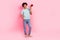 Full body photo of attractive young man hold loudspeaker announce discount wear trendy blue clothes isolated on pink