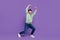 Full body photo of attractive young man lifting empty space struggling wear trendy gray clothes isolated on violet color